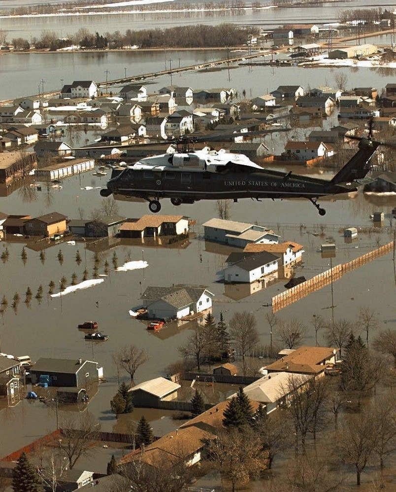President Clinton's helicopter over flood damage