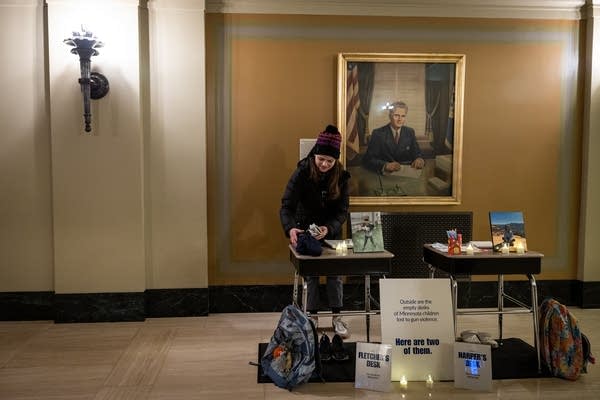 A woman sets up a memorial