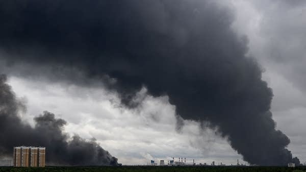 Smoke rises from an oil refinery outside of Moscow. Ukrainian attacks have jeopardized global supplies of refined fuels.