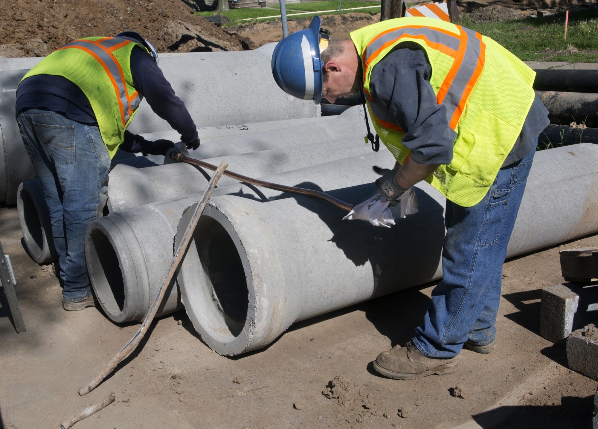 St. Paul workers prepare new copper pipe.
