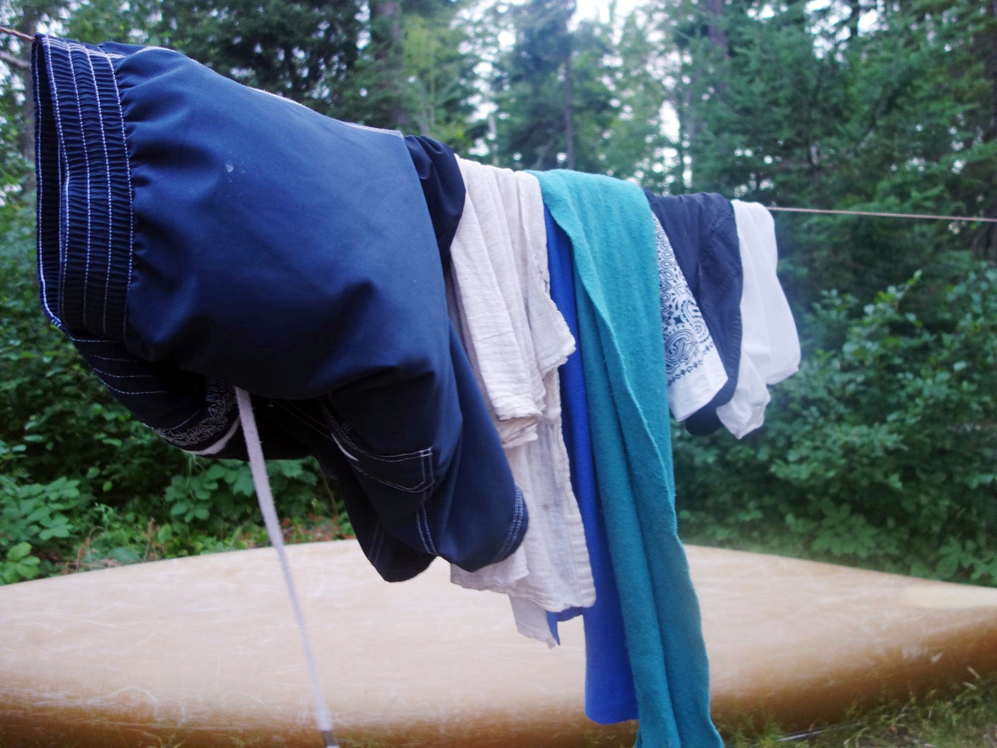 Clothes and towels dry on a line