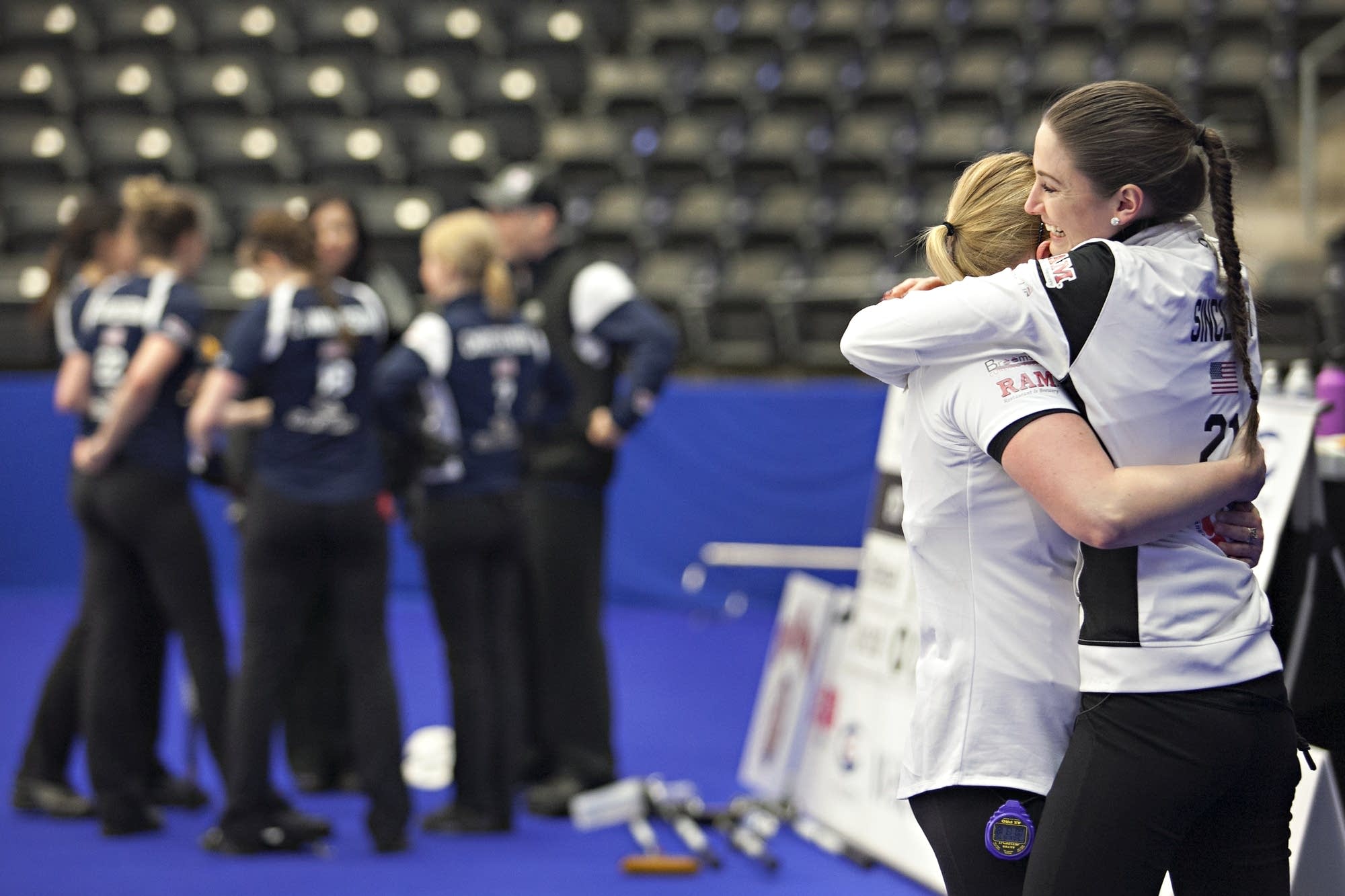 Jamie Sinclair and Alex Carlson embrace after winning the national title.