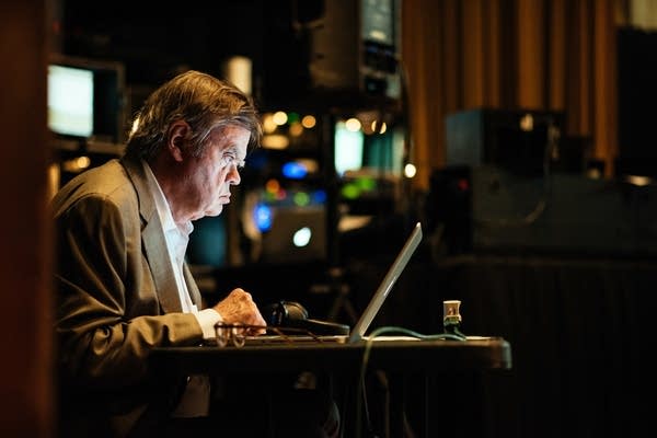 Garrison Keillor looks over scripts in Nashville