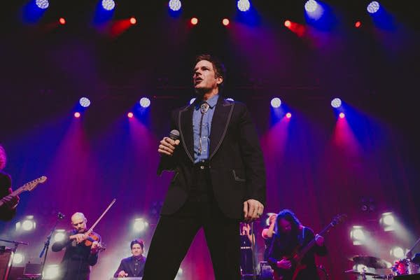 A musician sings onstage