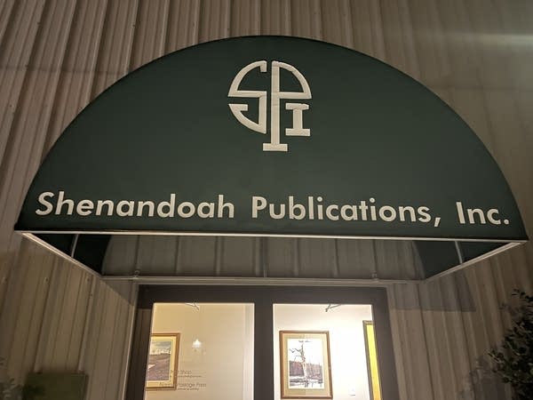 A green awning that says "Shenandoah Publications, Inc"