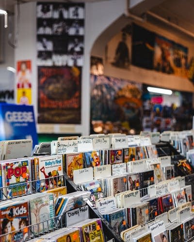 An array of CDs on display in a record store