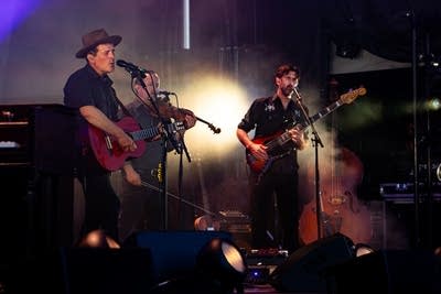 Gregory Alan Isakov and band performing on stage