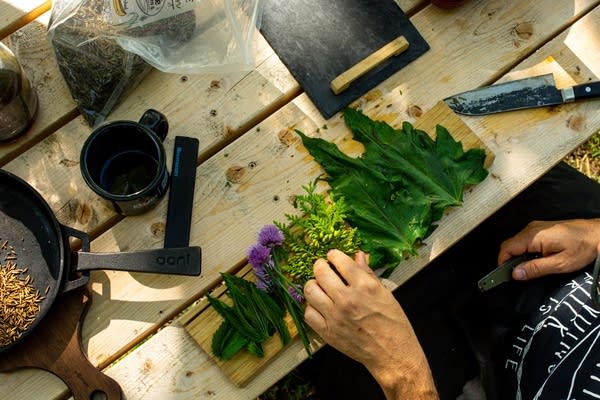 A tray of edible plants on a table.