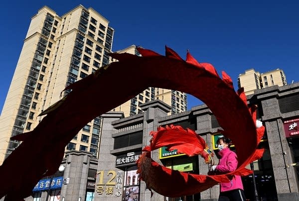 The troubled Chinese property giant Evergrande needs to make overdue interest payments this week.