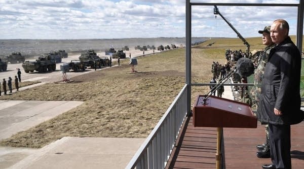 Russia's President Vladimir Putin (R) and China's Defense Minister Wei Fenghe watch the parade of the participants of the Vostok-2018 (East-2018) military drills at Tsugol training ground not far from the Chinese and Mongolian border in Siberia, on September 13, 2018. 