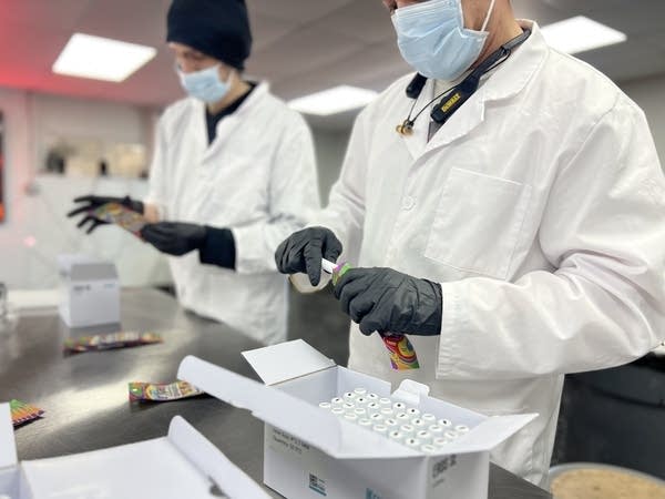 Man packages a cannabis vape