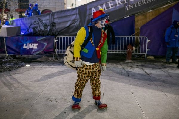 A clown stands on Nicollet Mall in Minneapolis on Friday, Feb. 2, 2018.