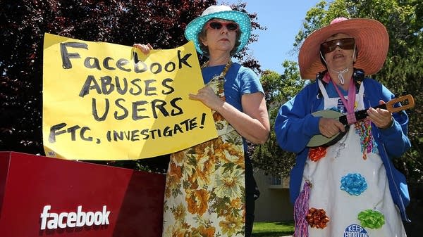 Ruth Robertson, left, and Shirley Powers of the Raging Grannies stage a demonstration outside of the Facebook headquarters in Palo Alto, California, in 2010. 