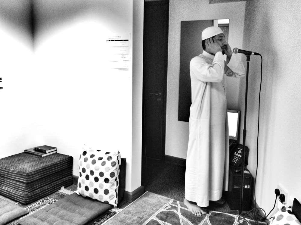A muezzin leads the call to prayer