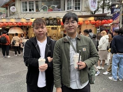 Darren Ling (left) and Chris Peng in front of a bubble tea shop in Taipei. (Jennifer Pak/Marketplace)