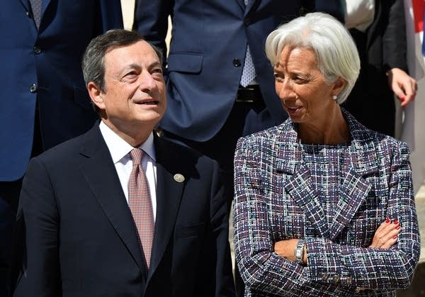 IMF Managing Director  Christine Lagarde (R) chats with the President of the European Central Bank (ECB) Mario Draghi.