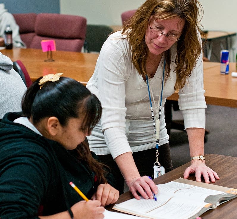 Laura Malott helps a student