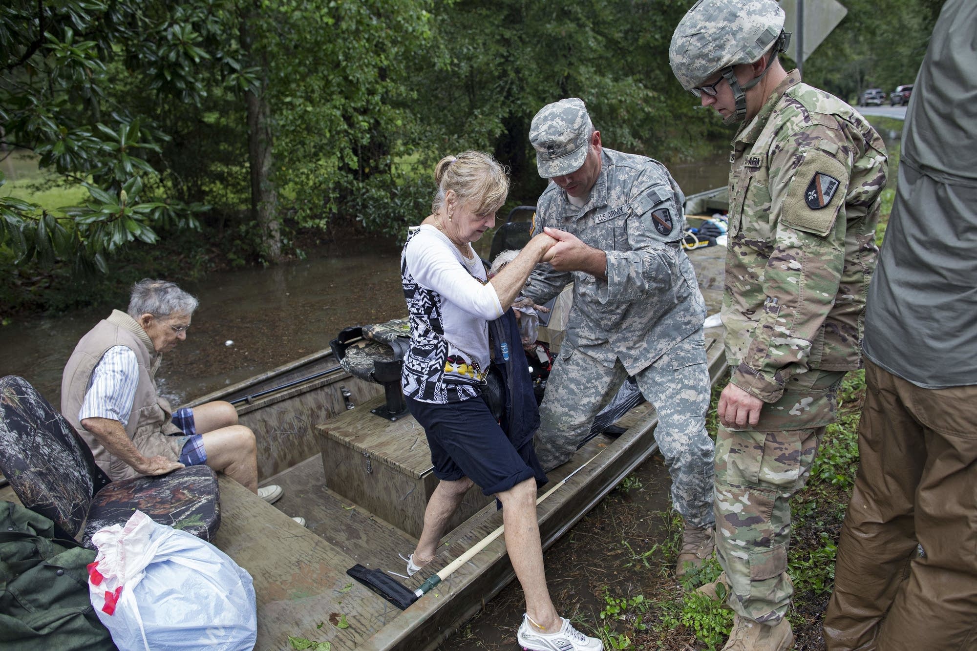 Flooding kills 6, sends thousands fleeing for higher ground in