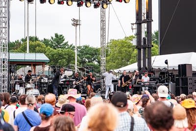 Revelation: A Celebration of the MPLS Sound performing on an outdoor stage.