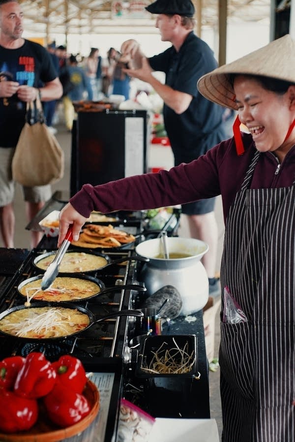 Two people work at a stand