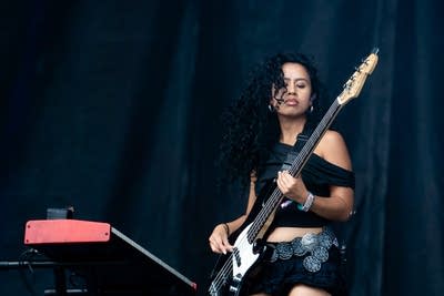 Gigi Perez and band on stage