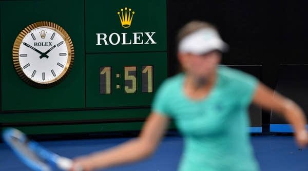 Belgium's Elise Mertens plays a shot beside a clock during a match against Australia's Daria Gavrilova at the Australian Open in Melbourne in January.