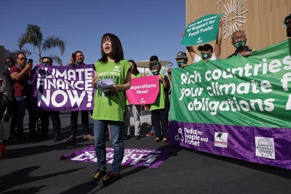 SHARM EL SHEIKH, EGYPT - NOVEMBER 09: Activists demanding climate finance and debt relief for countries exposed to the effects of climate change protest at an impromptu demonstration at the UNFCCC COP27 climate conference on November 09, 2022 in Sharm El Sheikh, Egypt. The conference is bringing together political leaders and representatives from 190 countries to discuss climate-related topics including climate change adaptation, climate finance, decarbonisation, agriculture and biodiversity. The conference is running from November 6-18. 