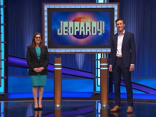 Two people on the set of a game show