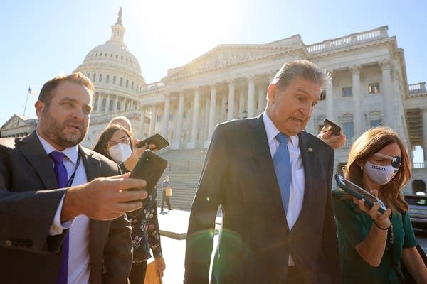 Sen. Joe Manchin reacts to a question about carbon tax as he walks back to his office following votes at the U.S. Capitol on Sept. 29. 