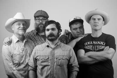 Five men standing together for a studio portrait