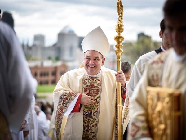 Archbishop Bernard Hebda greets priests, deacons