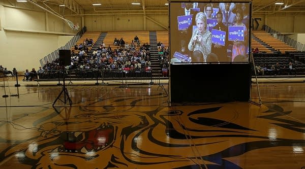 An overflow crowd watches a video feed of democratic presidential candidate former Secretary of State Hillary Clinton as she speaks during a 'Get Out The Vote' rally at the University of Arkansas-Pine Bluff on February 28, 2016 in Pine Bluff, Arkansas. 