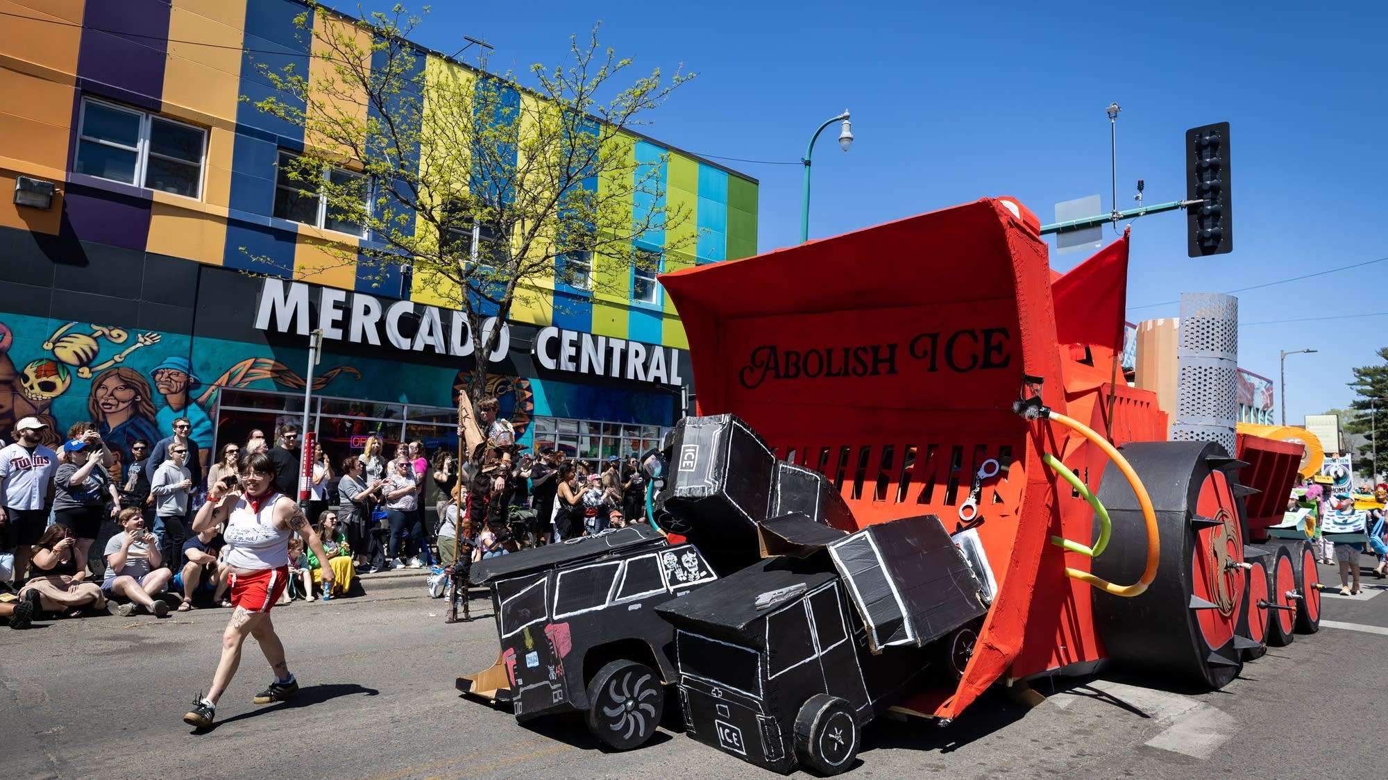 Mayday festival in Minneapolis, usually a celebration of spring, grieves neighbors lost to ICE surge