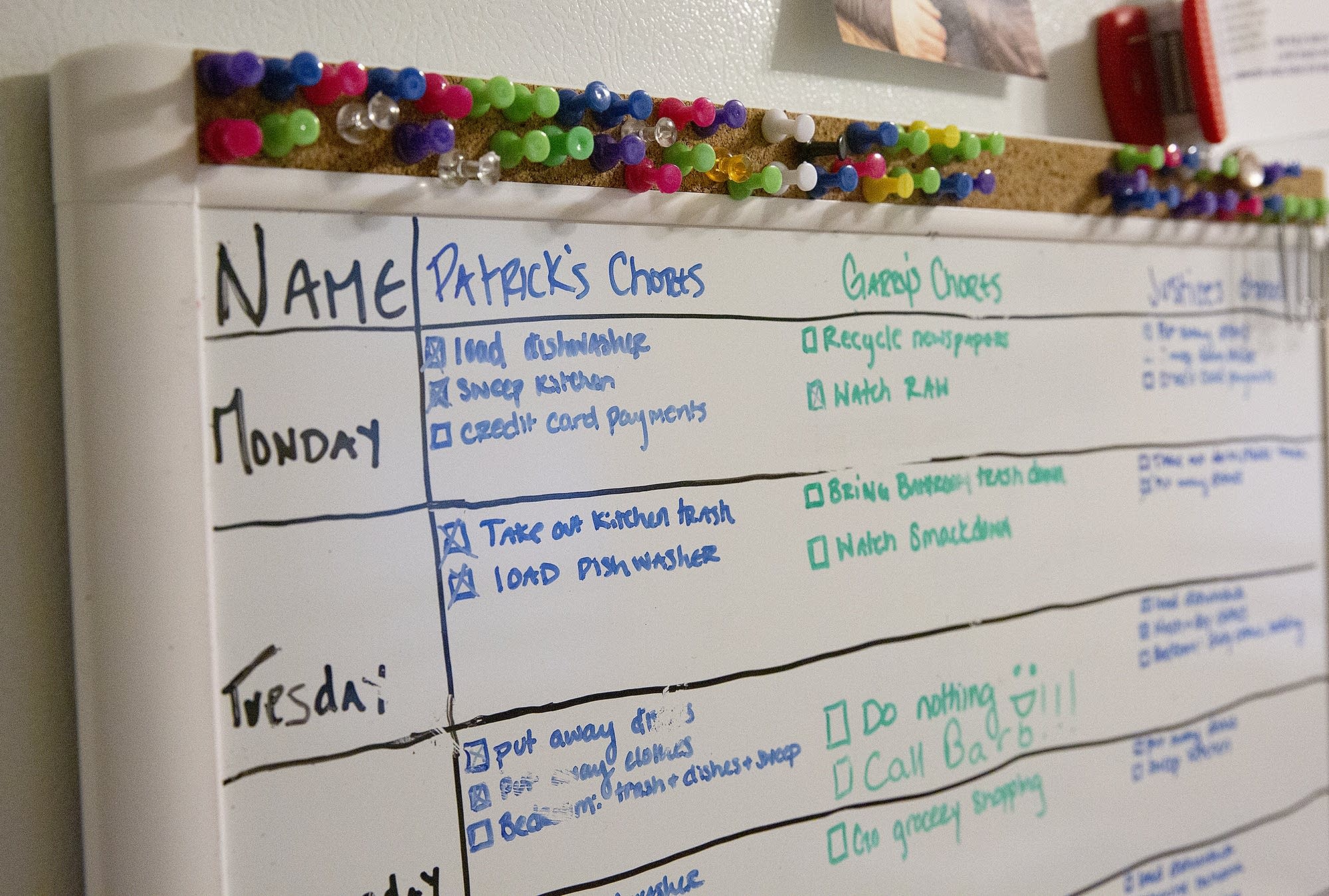 A dry erase board details daily chores.