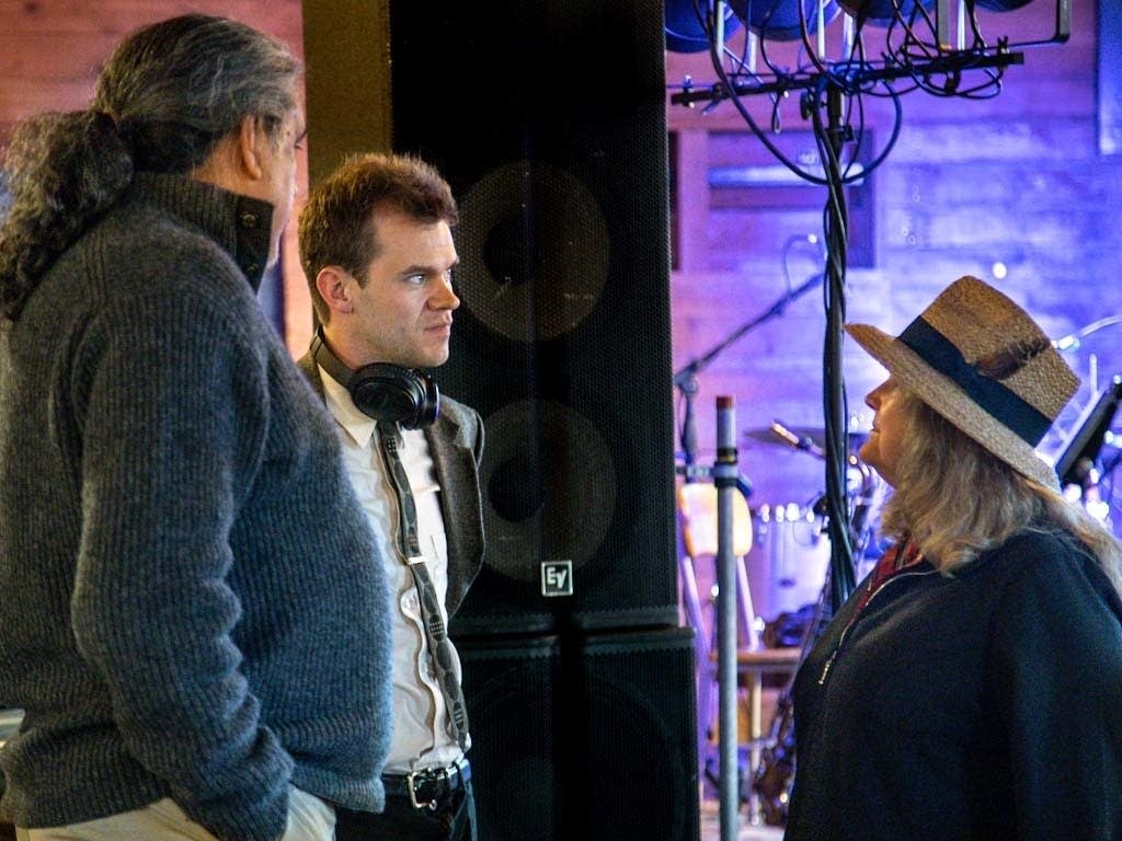 Sam Miltich (center) talks with audience members.