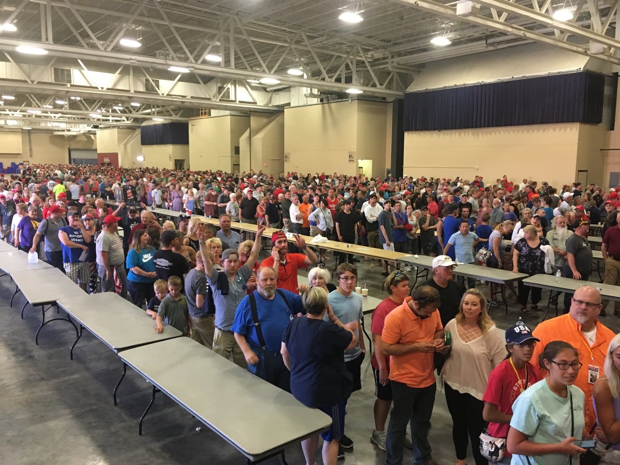 People stand in line trying to get into the President Trump rally.