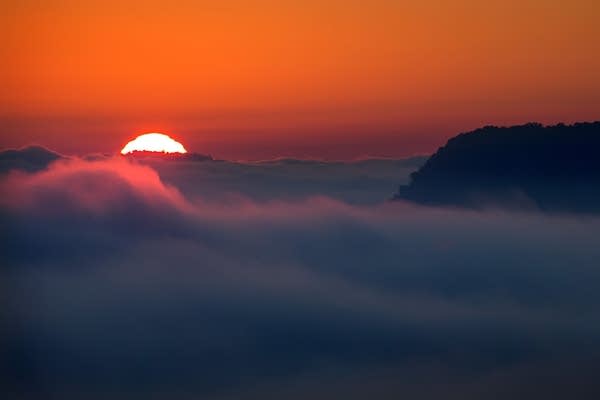 Fog lifts on an October morning.