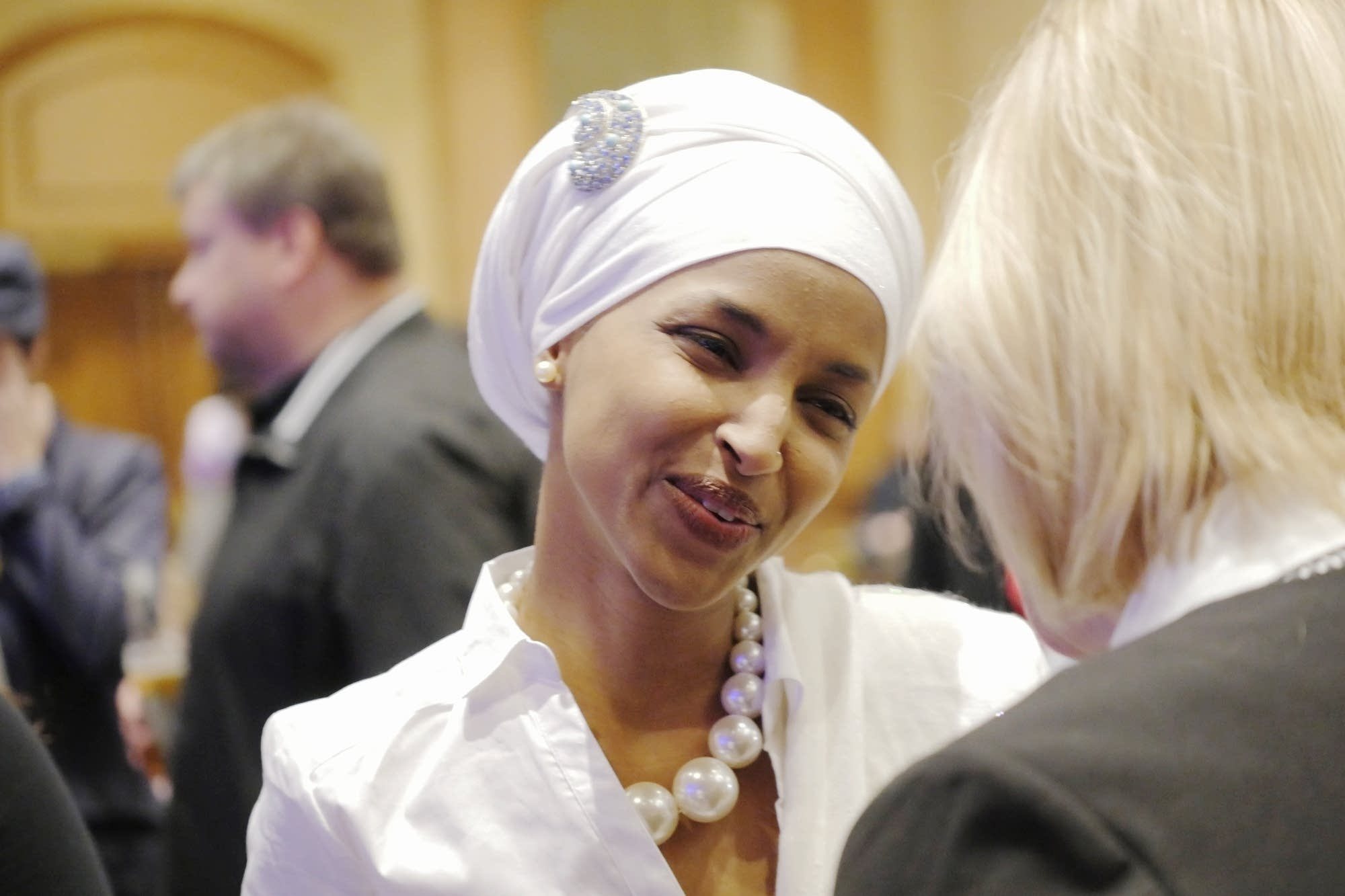 Ilhan Omar greets people at the DFL party.