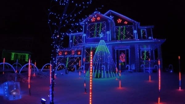 A house decorated in holiday lights.
