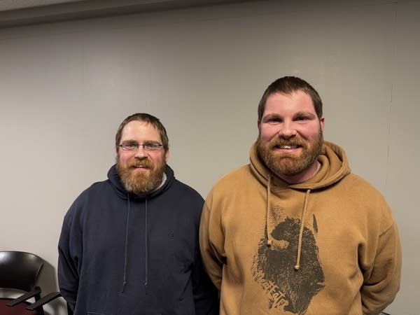 Two people pose for a photograph.