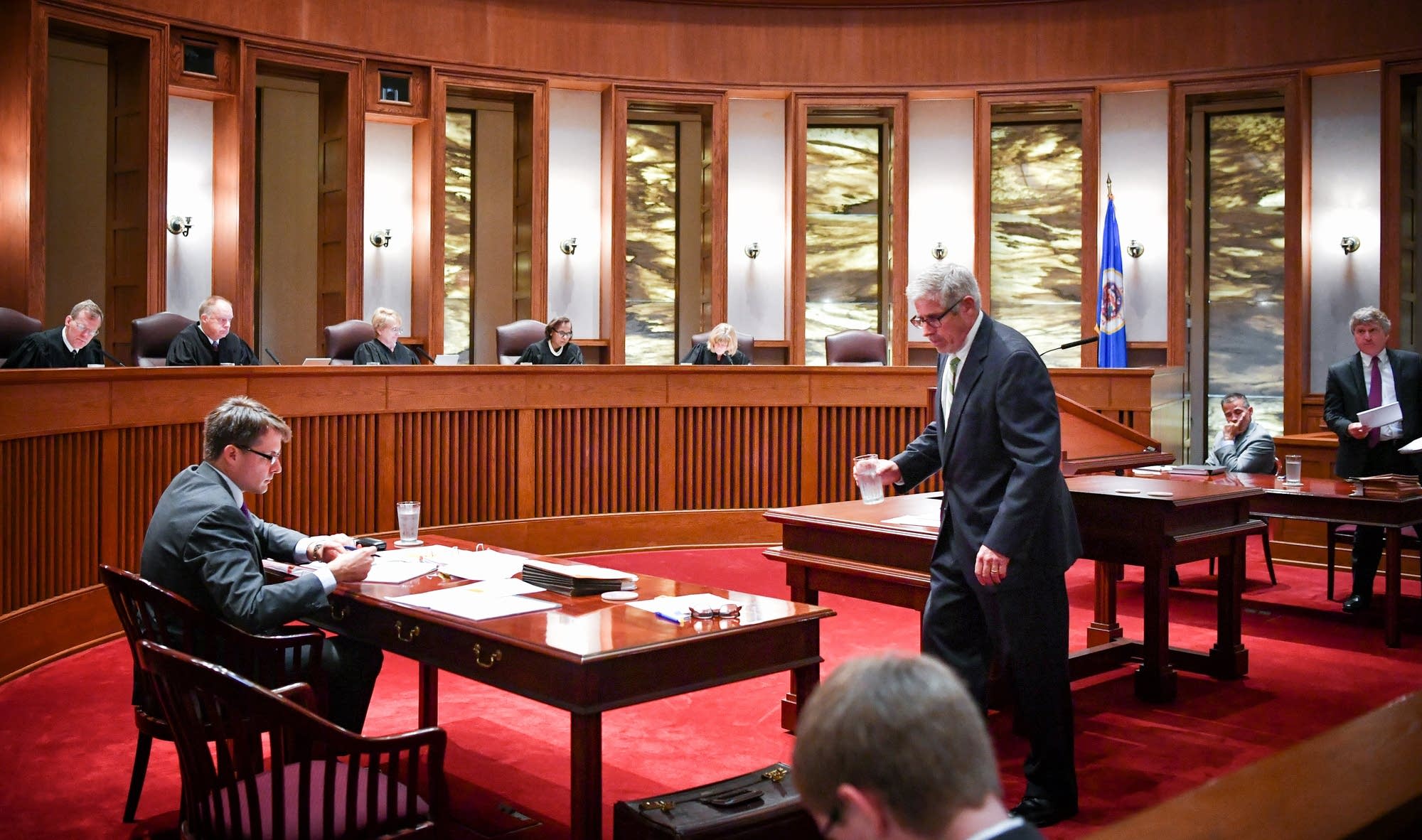 Court 15 minimum wage, insurance for cops won�t appear