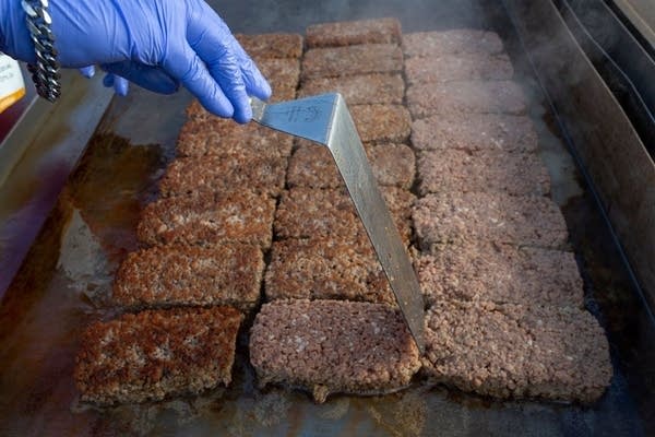 A man prepares Impossible Pork, a new plant-based pork product by Impossible Foods, at the 2020 Consumer Electronics Show in Las Vegas.