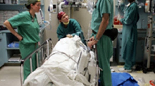 Medics in a CAT scan room in Miami, Fla.