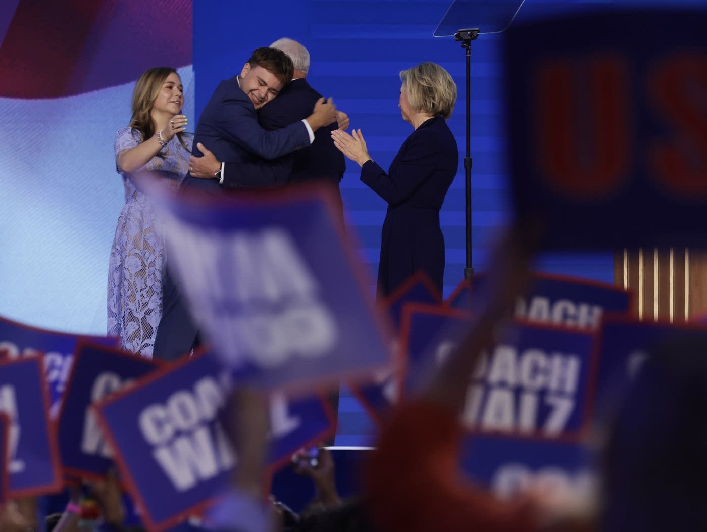 26e949-20241002-two-men-hug-on