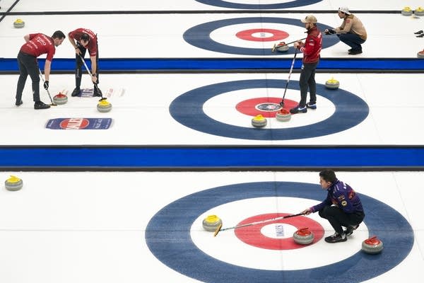 People compete in the curling championship