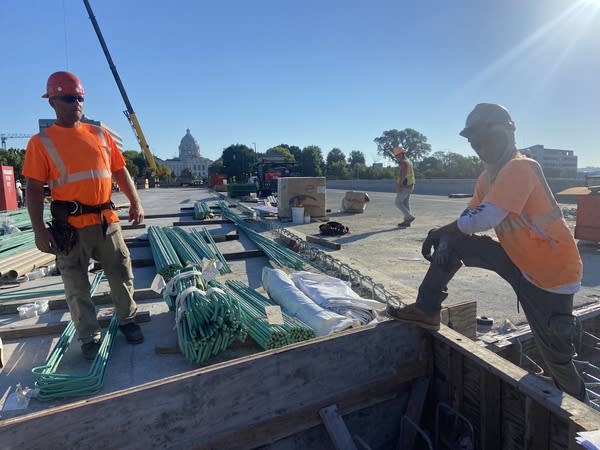 Two constructions workers at a work site