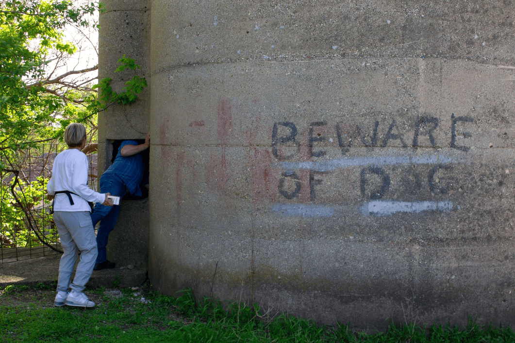 Someone checks inside of a silo