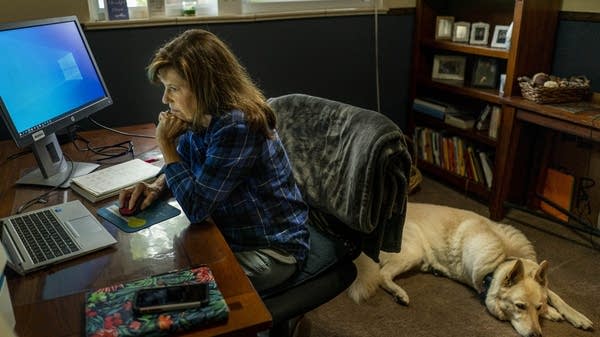 ARVADA, COLORADO - August 16, 2022: Indivisible activist Robin Kupernick works from home, with her dogs always near, in Arvada, Colorado Tuesday August 16, 2022. (Melina Mara/The Washington Post via Getty Images)
