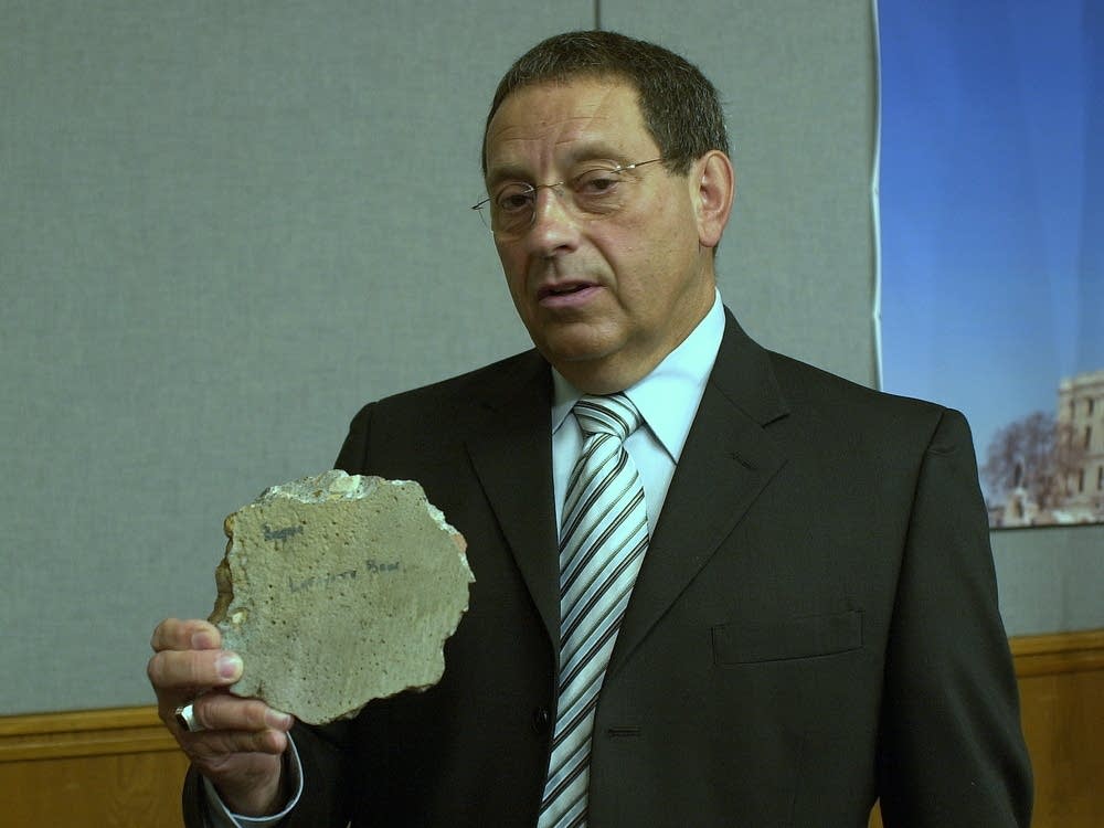 Sen. Jim Carlson with a chunk of a bridge