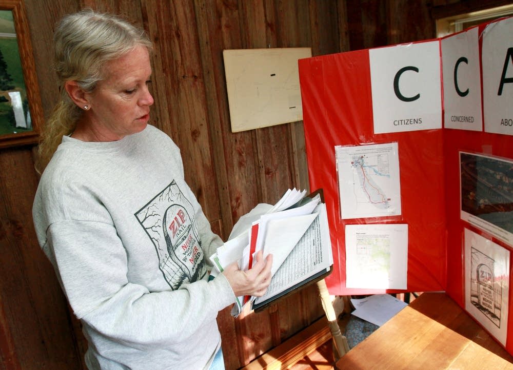 Heather Arndt flips through signatures of people o
